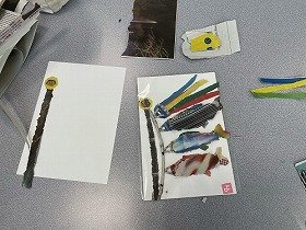 画像:マンションの広告を利用したこいのぼり作成の様子。