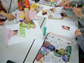 写真1：破いた色紙をスティックのりで貼り合わせている写真。