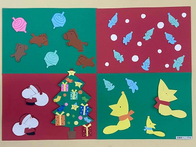 クリスマスツリーとサンタクロース、雪とともに舞う妖精、マフラーを巻いたキツネなどが貼られた冬の壁面飾りです。