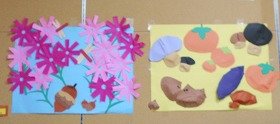 写真1　左は画用紙で作ったピンク色のコスモスの花が咲いている様子。右は折り紙でつくった柿、きのこ、栗など秋の味覚。